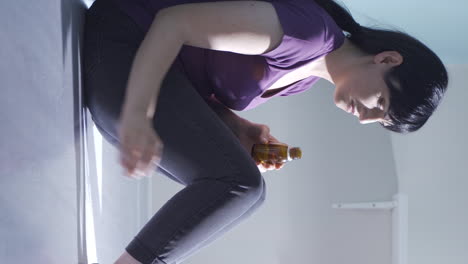 Vertical-video-of-The-woman-who-wants-to-commit-suicide-by-taking-pills.